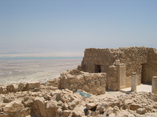 Ruins overlooking the Dead Sea. Homes like this could be afflicted with tzaraat during Biblical times. [Photo: Wiki Commons]